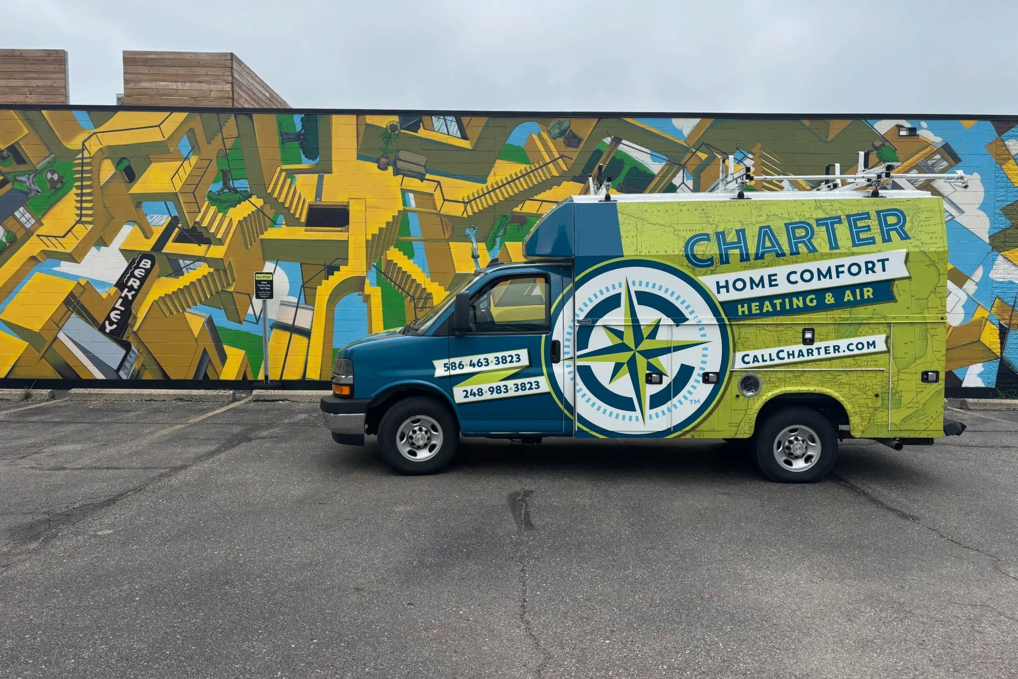 Charter Home Comfort van Parked In front of a mural in Berkley Mi